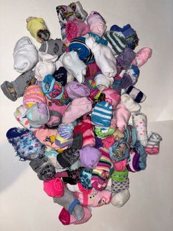 Bundle of colorful kids socks, various sizes and patterns