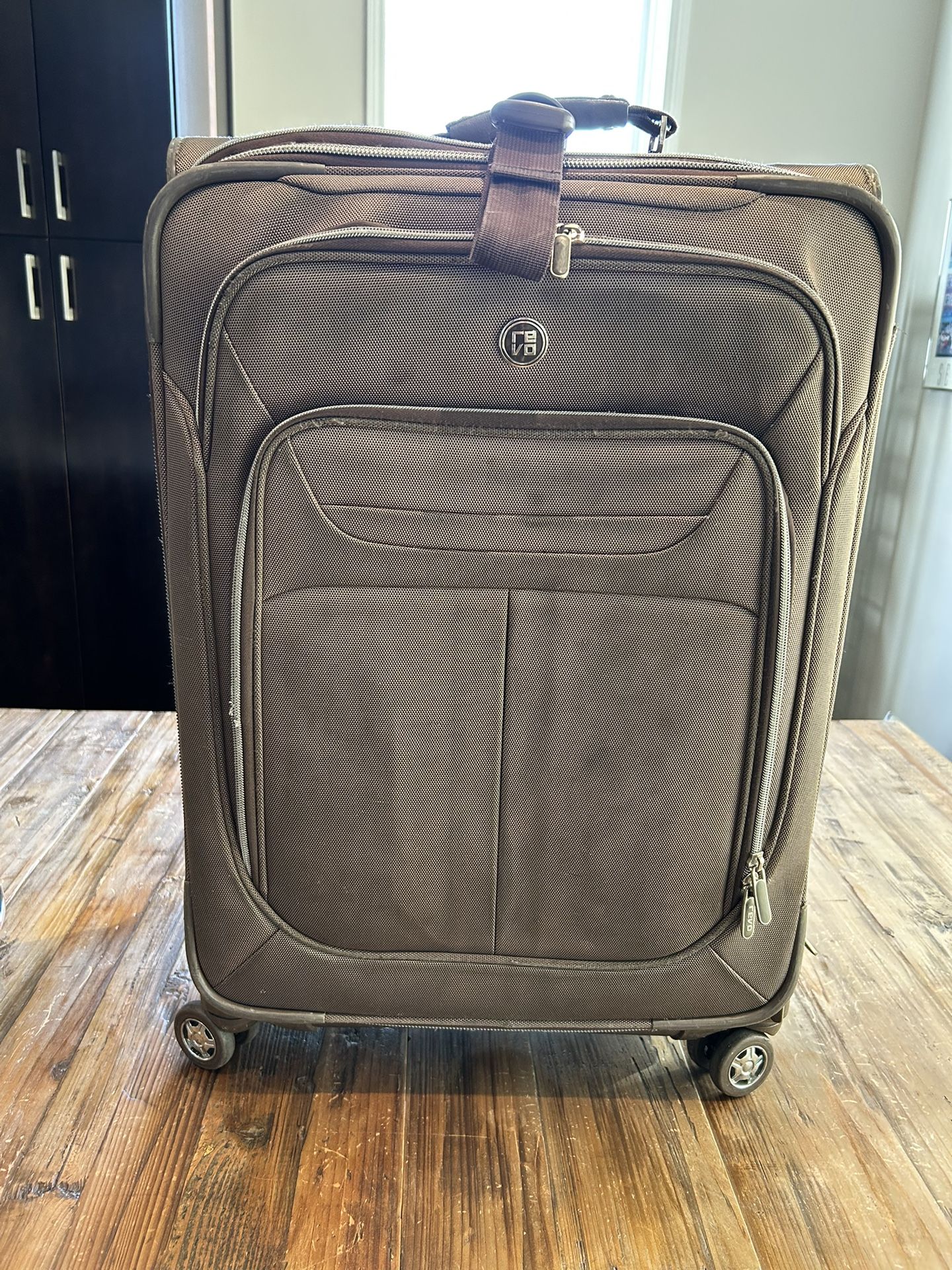 Revo Luggage. 24”. Brown.