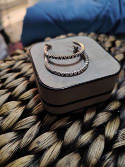 Sterling silver inch wide hoop earrings with unknown clear stones