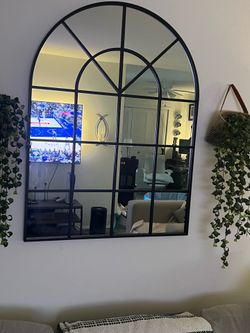 Black metal wall mirror