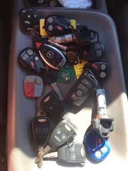 Gm keyless remotes and Benz and a BMW Remote several Chrysler remotes and 2 Gm ignitions with the key and 2 ford keyless remotes...