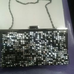 Hand bag clutch, new in box