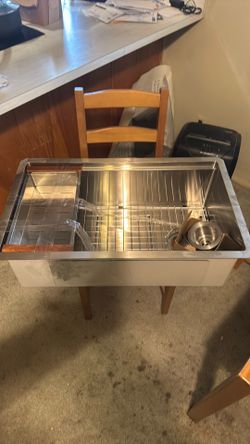 Never installed stainless farm sink
