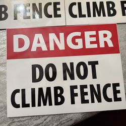New fence sign danger do not climb