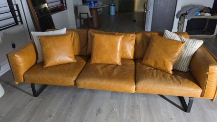 Tan Leather 3-Seat Sofa with Black Metal Legs and furniture to furnish a 1 bedroom