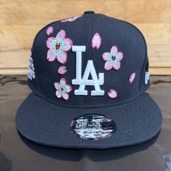 Brand new with tags New Era 9FIFTY snapback featuring Los Angeles Dodgers design with cherry blossom embroidery.