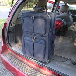 NICE AMERICAN TOURISTER PULL ALONG LUGGAGE