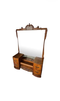 Vintage 1930s Art Deco waterfall vanity with a large carved mirror on casters