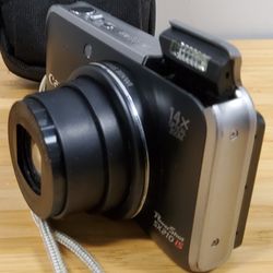 Canon PowerShot SX210IS 14.1 MP Digital Camera with 64GB SD Card, Tamrac Case,
14x Wide Angle Optical Image Stabilized Zoom and 3.0-Inch LCD