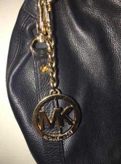 Authentic MK leather cross body bag in excellent condition