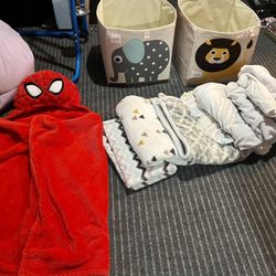Lot Of Toddler/crib sheets, mattress cover, bins, and Spider-Man blanket. 