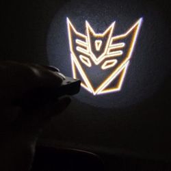 2 Wireless Universal Decepticon Or Autobot Transformers Projector Car Door Puddle Lights AAA Batteries Not Included SHIPPING AVAILABLE 