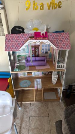 Used wooden doll house