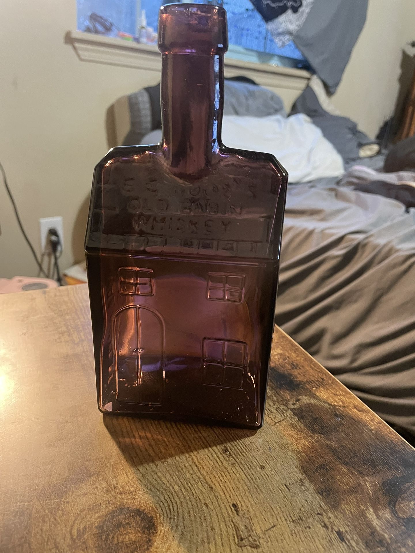 Old Purple Glass Cabin Whisky Bottle