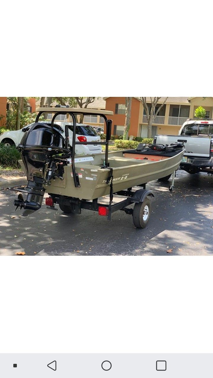 14 tracker 15hp merc /w trailer trolling motor polling platform and bass deck