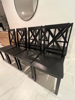 8 Brand new black wood dining chairs