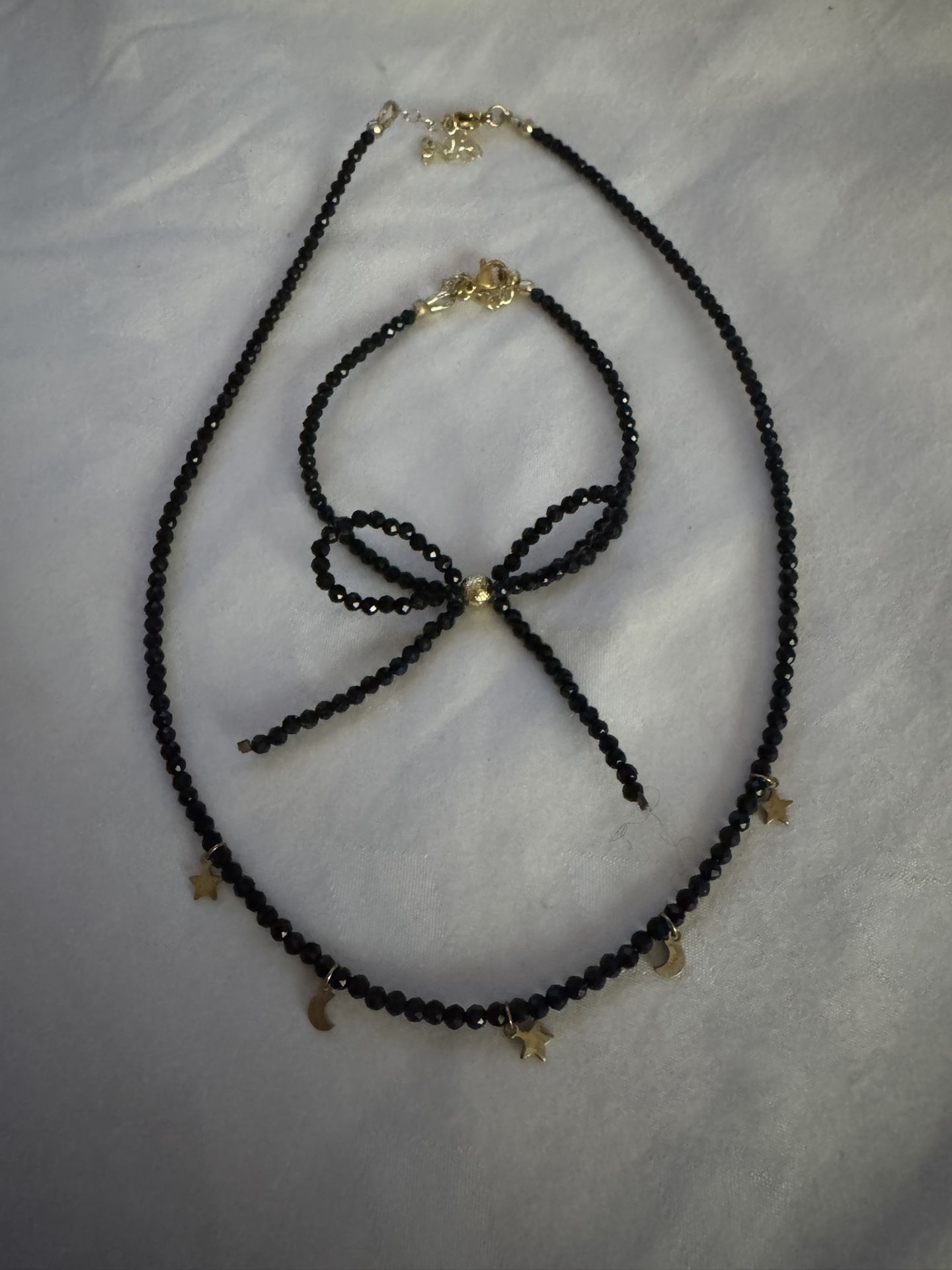 black matching choker and bracelet.