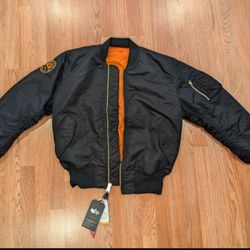 Alpha Industries MA-1 Flight Jacket. Reversible: Black/Bright orange.
Size: Medium.