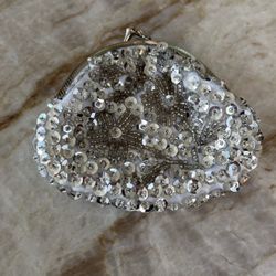 A Small Sequined Coin Purse In Silver. 