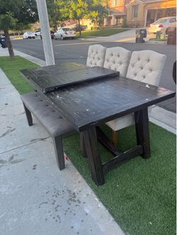 Wood table with chairs and bench