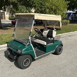 1999 green club car ds 2 passenger seat golf cart electric charger enclosure 48v
DRIVES GOOD WITH GOOD BATTERIES