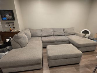 Grey Sectional and outtomand w/ storage