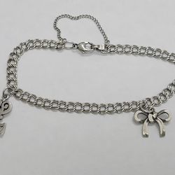 James avery silver charm bracelet with a key and bow charm