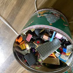 I Have Four Christmas Tins Full Of Legos Is Got Wheels Figures And All Different Things Need $150 for all of them
