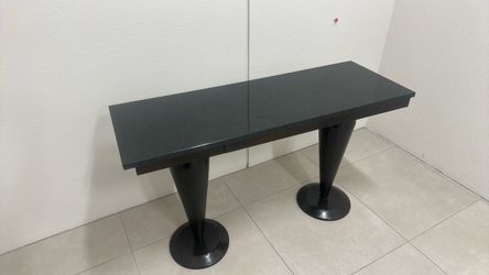 console/sofa table with two pedestal legs.