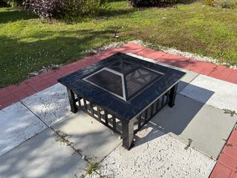 black metal wood-burning fire pit