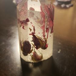 resin crystal with rose buds and petals, and snake vertebrae