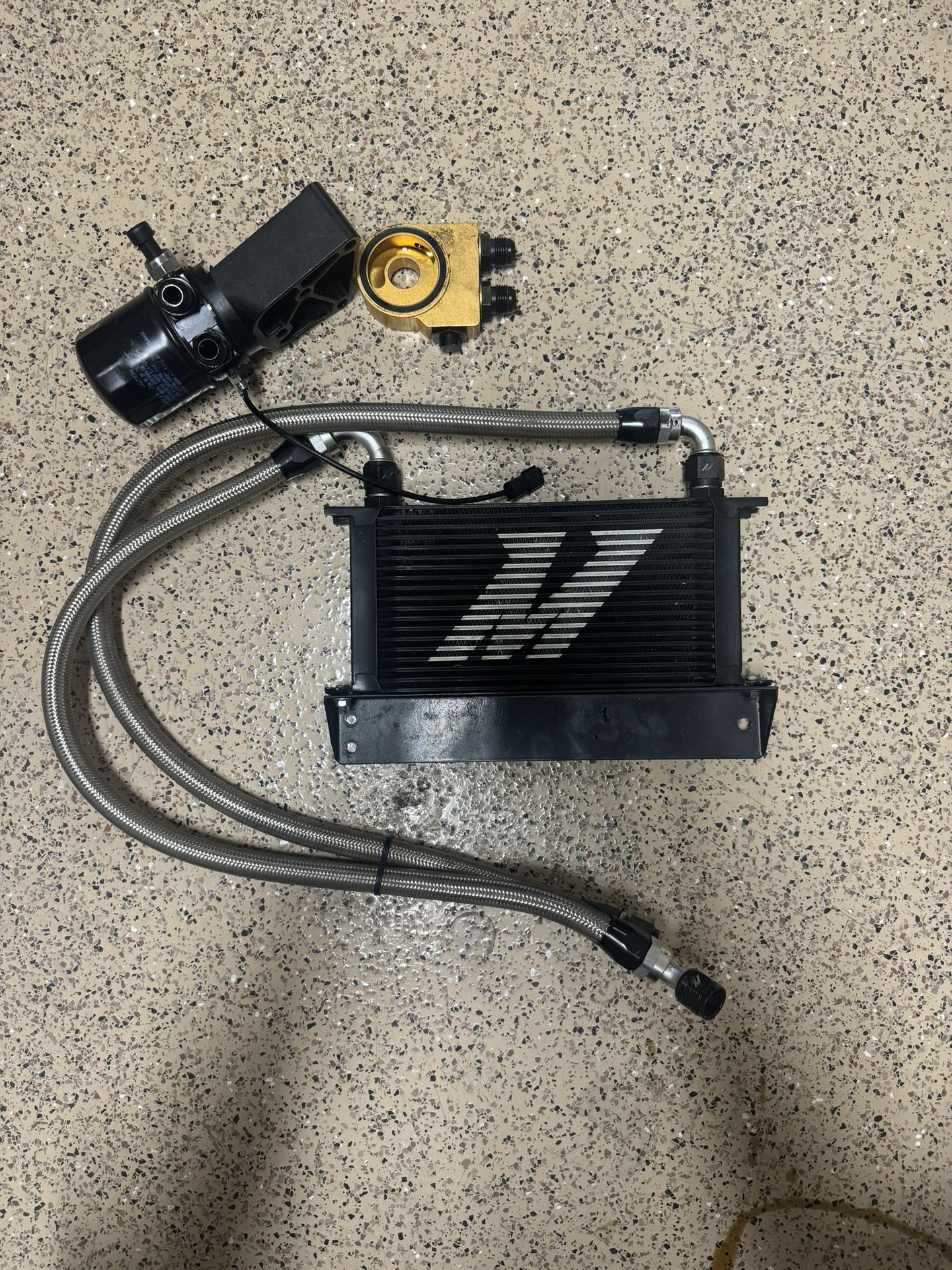 Black mishimoto thermostatic oil cooler