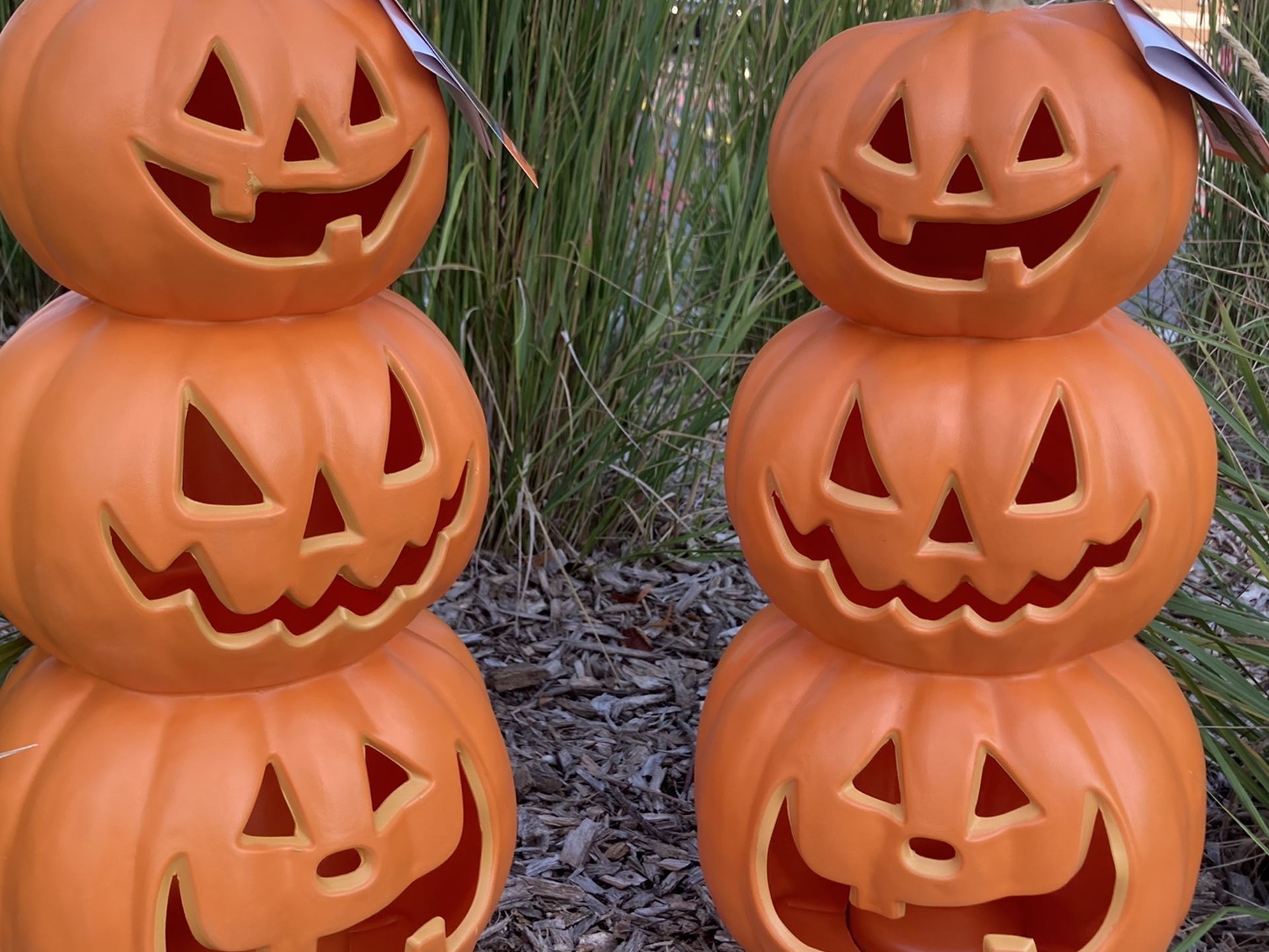 Two matching topiary pumpkins