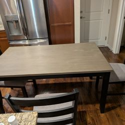 Table with beige bench and chairs - $300