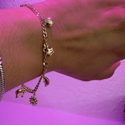 HERMOSA PULSERA CON  DIFERENTES DIJE ORO 14K