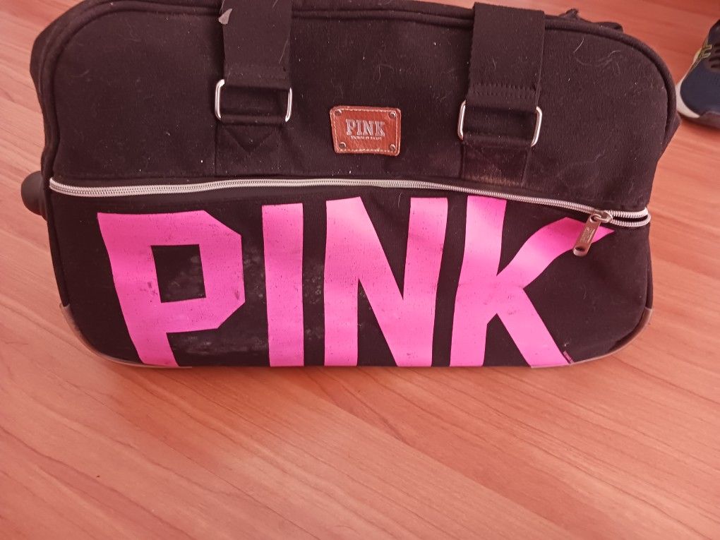 Pink Rolling Bag In Used Condition 