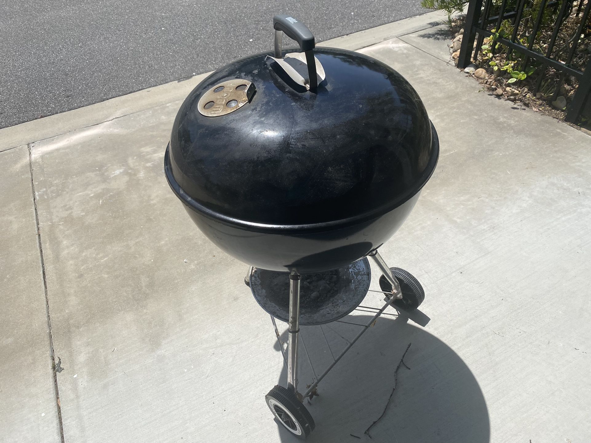 Weber 22 In With charcoal rails And charcoal