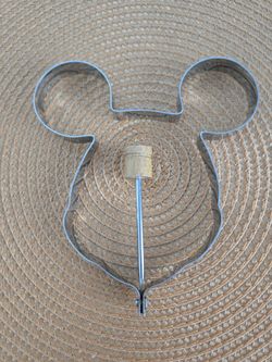 The Mickey Mouse Metal Mold with Handle is a charming and practical kitchen tool perfect for creating Mickey Mouse-shaped pancakes, and eggs.