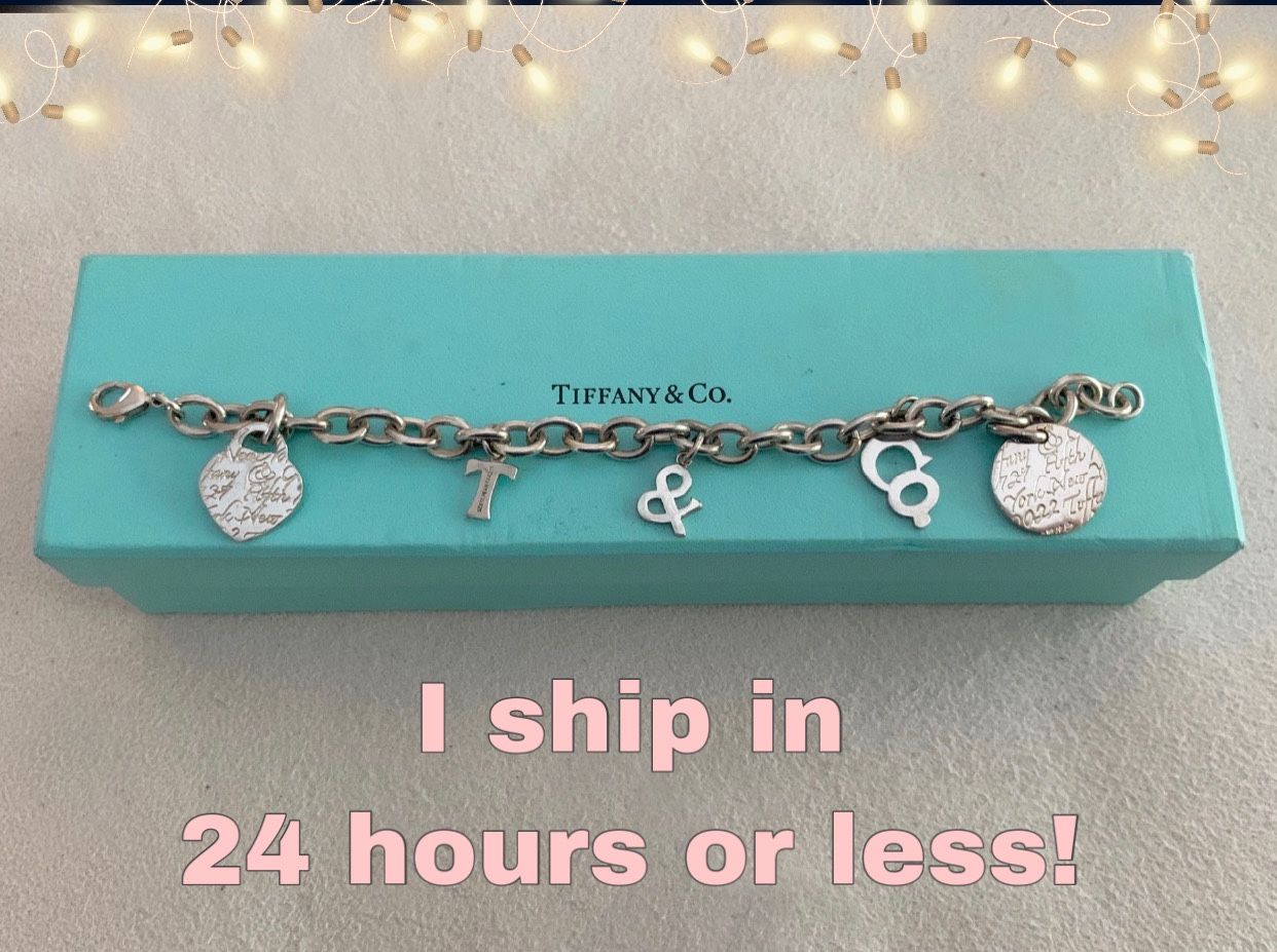 Tiffany & Co. sterling silver charm bracelet and box