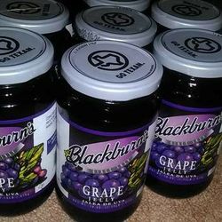 8) Jars of Grape Jelly Blackburn's brand. 18 oz jars 