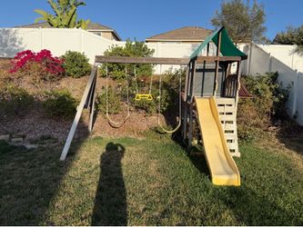 Swing set with slide