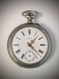 S.M.C antique pocket watch from 1800s or early 1900s. 6 Rubies Jewels. Seems to run? But sometimes stops.  Gave the balance wheel a gentle push and it