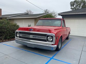 1970 Red Chevy C-10 long bed pickup truck