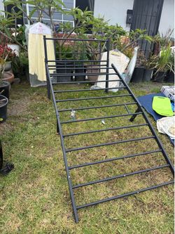 Black metal twin bed frame