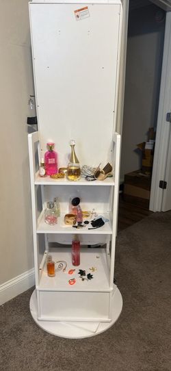Freestanding rotating jewelry and mirror stand