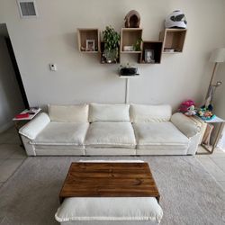 118 Inch Beige Sofa With Table Over Ottoman