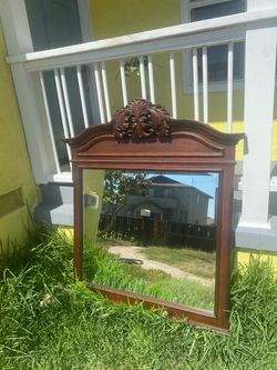 Large wall hanging mirror. Size 42 x 52. Solid wood. No brakes or cracks. Comes with mounting hardware.