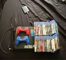 Ps4 console with games and with 2 controllers also with a external hard drive thats hold 2 TB