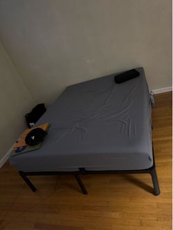 Queen size frame with mattress.
