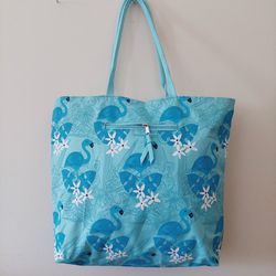 16"×18" Flamingos and Flowers Aqua Blue Teal Canvas Polyester Beach School Book Tote Shoulder Bag with One exterior and one interior zippered pockets.